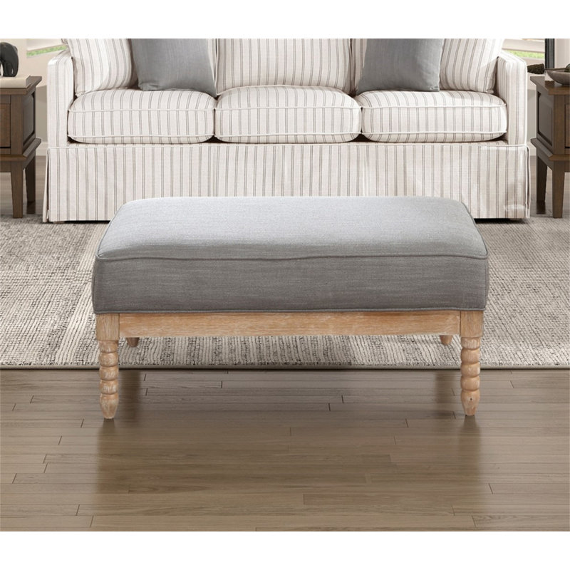 Repose-pieds classique en tissu gris avec repose-pieds et tissu gris
