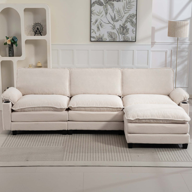 113" Modern 3+1 L-Shaped Corduroy Fabric Sofa,Modular Sectional Cloud Couch W/Ottoman,35D High-Resilience Sponge&Double-Layer Thick Cushion,Cup Holders,Storage Bags