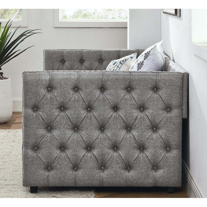 Twin sized upholstered daybed featuring two drawers, adorned with buttons and copper nails on its square arms, Grey