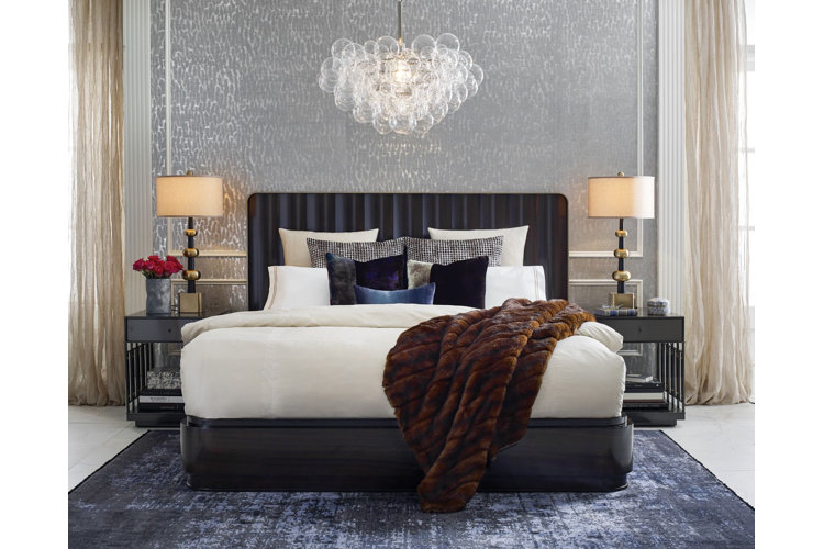 A bed with plush bedding.