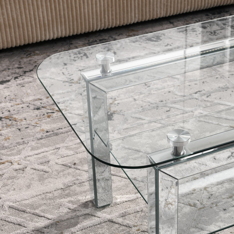 Élégante table basse rectangulaire en verre trempé avec tablette et pieds en miroir