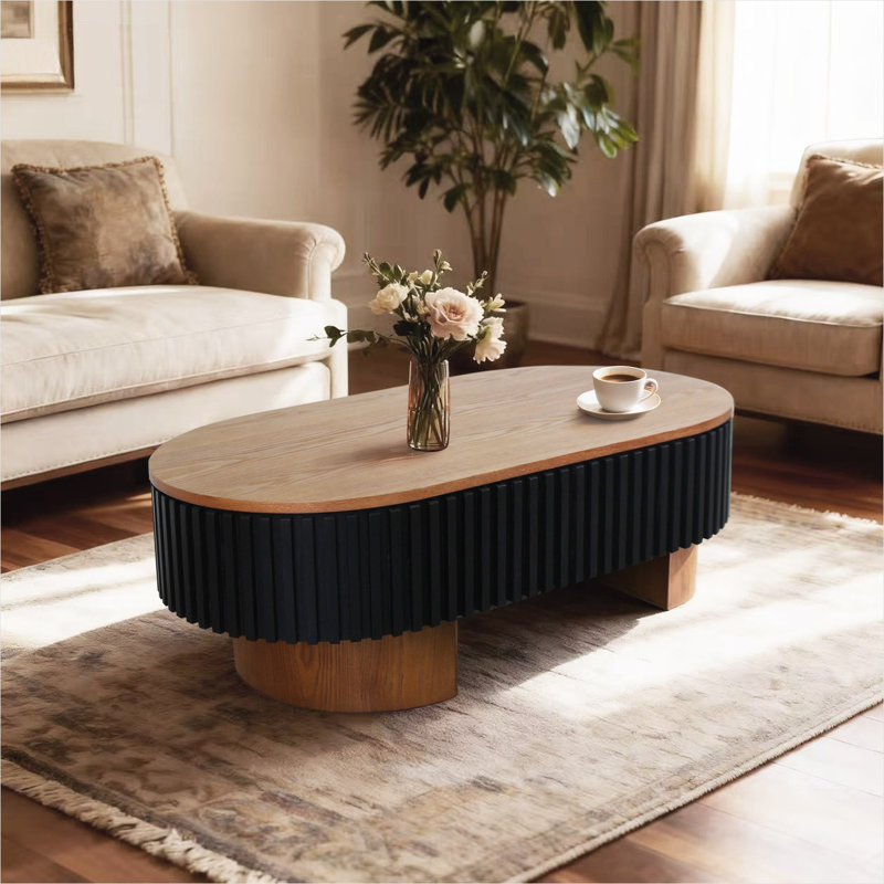 Table basse ovale en bois massif de 43,7 pouces avec rangement dissimulé et plateau amovible, design cannelé moderne noir classique pour le salon ou le bureau