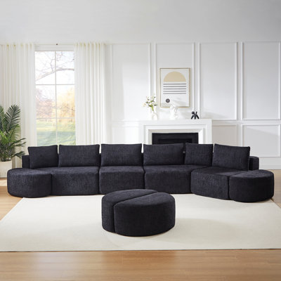 Modular Sofa Set With Decorative Pillows And Curved Footstools