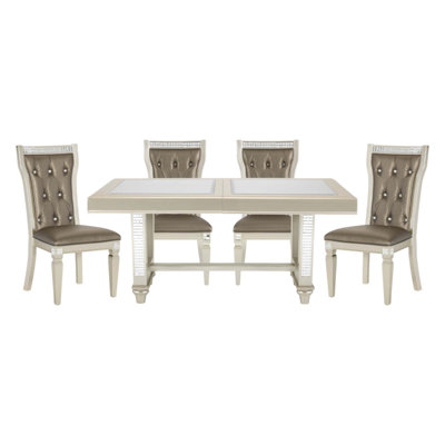 Ensemble repas 5 pièces de style glamour avec finition champagne, plateau en verre et chaises capitonnées pour une expérience culinaire élégante