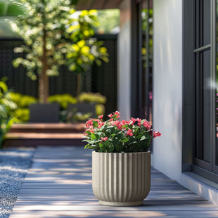 Pot à fleurs moyen rond en béton avec trous de drainage