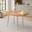 Table rétractable en MDF imitation bois avec pattes en métal argenté, gain de place et élégante pour une salle à manger moderne