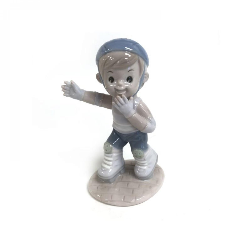 Boy On Rollerblades Figurine