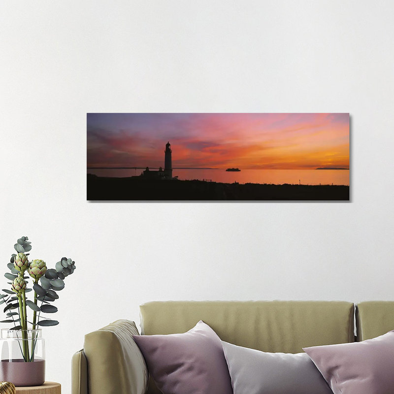 Silhouette Of A Lighthouse At Sunset, Scotland by Panoramic Images - Wrapped Canvas Panoramic Print