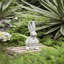 Statue de lapin en ciment patiné