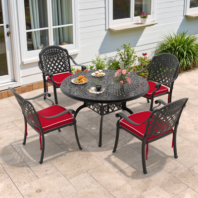 Haverville 48.03 -inch Round Table Cast Aluminum Outdoor Dining Set with Umbrella Hole and Red Cushions by World Menagerie