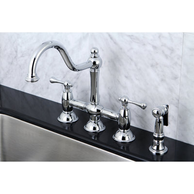 Kingston Brass Restoration Two-Handle 4-Hole Deck Mount Bridge Kitchen Faucet with Brass Side Sprayer