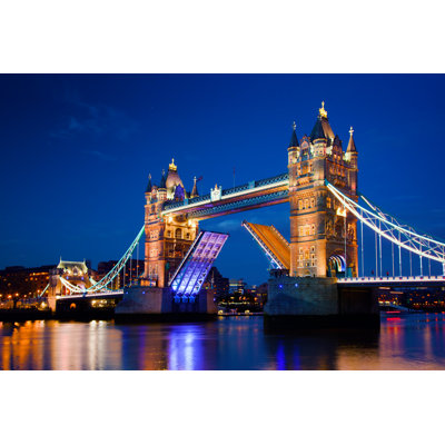 Tower Bridge In London, The UK At Night by NiseriN - Wrapped Canvas Print