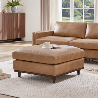 Mirella 35"W Overstuffed Feather-Blend Faux Leather Ottoman With Solid Wood Legs