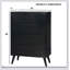 Commode 4 tiroirs Mid-Century moderne noire avec poignées encastrées et pieds ronds effilés, parfaite pour le rangement contemporain