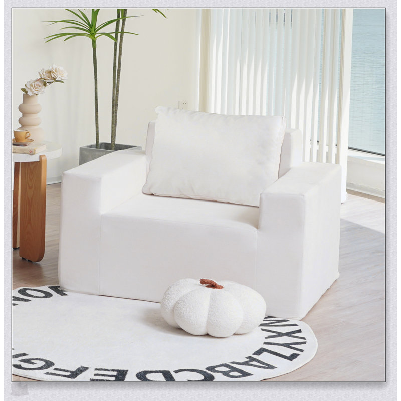 Canapé confortable en mousse haute densité dans une boîte avec coussin, parfait pour la détente et les sièges polyvalents