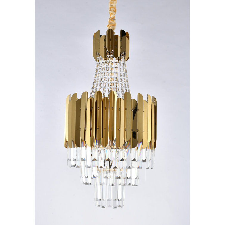 This Exquisite Chandelier Is In A Gold Finish. The Frame Is Made Out Of Metal, And It Comes With Clear Hanging Crystals. The Adjustable Chain Link Makes This Fixture Suitable For Most Ceiling Heights.