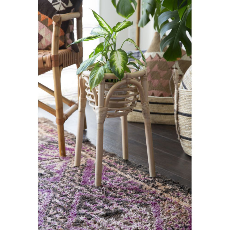 Support à plante en rotin