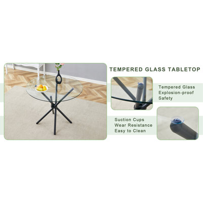 Une table ronde circulaire en verre trempé transparent d'un diamètre de 36,6 pouces, avec des pieds en métal noir rassemblés en forme d'anneau. Le verre du bureau a une épaisseur de 0,3 pouce. W1151P294396