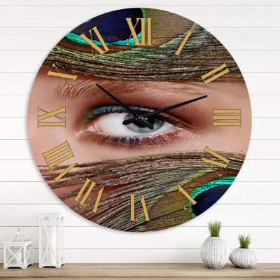 Oeil et plumes de paon - horloge murale bohémienne et éclectique