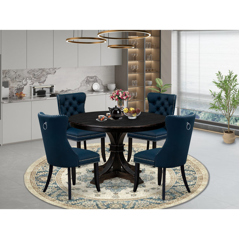 L'ensemble de table de salle à manger 5 pièces comprend une table ronde de 48 po avec piédestal et 4 chaises rembourrées bleu marine, noir sablé