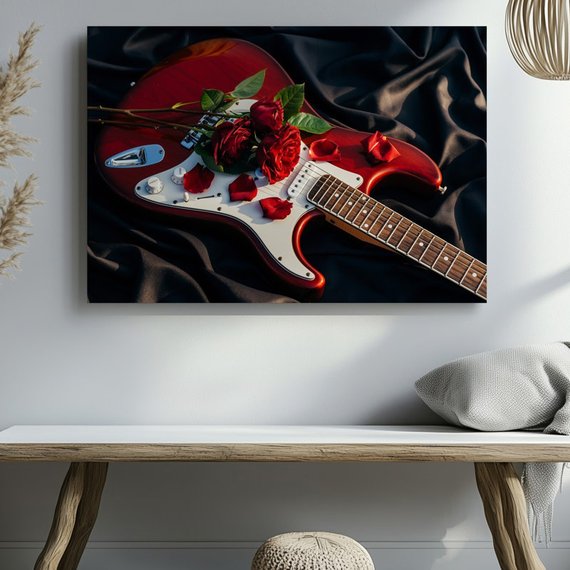 Toile, composition rapprochée avec une guitare électrique rouge éclatante posée sur un fond en tissu soyeux foncé