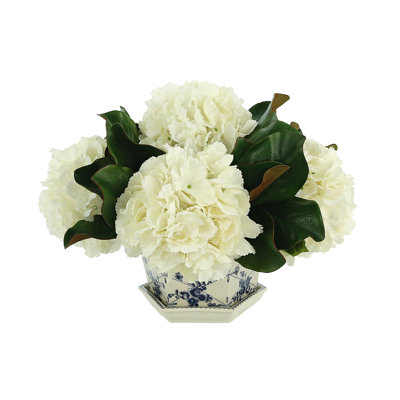 Hydrangea And Magnolia Leaves In Ceramic Vase
