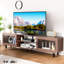 Console de télévision en bois de noyer avec portes coulissantes, prises de courant et support de rangement Mid-Century de luxe en noyer, 2 ports AC, portes