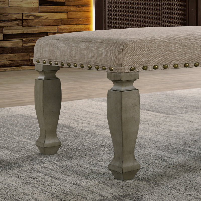 Banc rembourré à têtes de clou