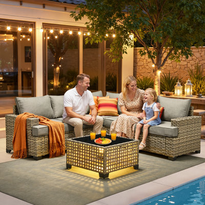 Canapé modulaire en osier pour 5 personnes avec coussins et table en verre Tommy