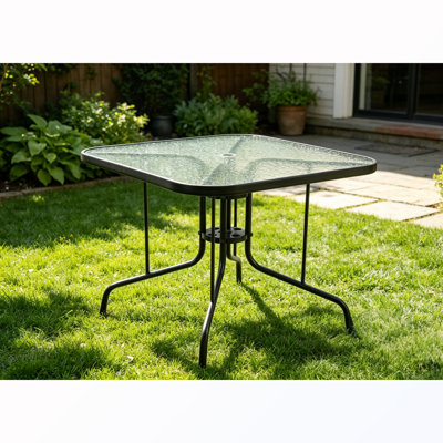 Table de salle à manger carrée avec plateau en verre et trou pour parasol