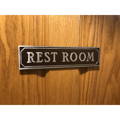 Plaque de porte de toilettes