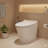 Smart toilet with a built-in heated seat, one-piece elongated contemporary design featuring adjustable seat temperature, automatic flushing, dual-flush system (1/1.28 GPF), foot-sensor activated flush, and a soft white nightlight controlled by a knob.