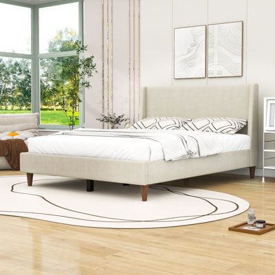 Lit plateforme tapissier en bois avec pieds en bois