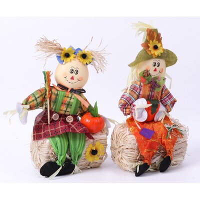 The Holiday Aisle® Scarecrow Boy and Girl Sitting on a Hay Bale ...
