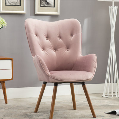 Chaise contemporaine en velours mauve avec dossier capitonné et pieds en bois massif. Structure en bois massif.