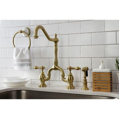Kingston Brass English Country Two-Handle 3-Hole Deck Mount Bridge Kitchen Faucet with Brass Side Sprayer