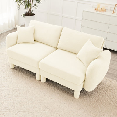2 sièges beiges avec coussins moelleux et ressorts hélicoïdaux pour un cadre moderne en bois Boucle