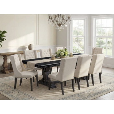 9-piece dining set consists of a dinner table and 8 Cream Linen Fabric dining room chairs & black legs with Button Tufted Back - Sand Blasting Black finish.