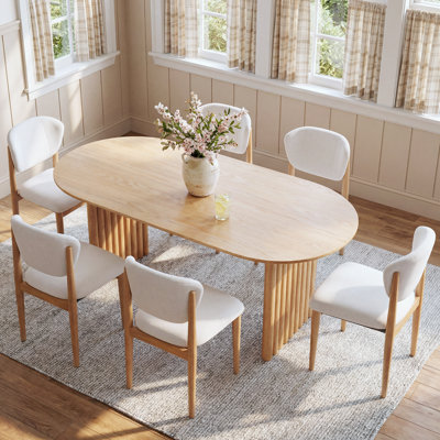Janik 6 - Person Oval Solid Wood Dining Table Set