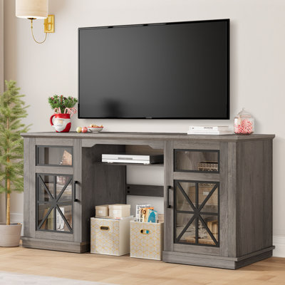 Leanne 3-Sided Glass Media Entertainment Center Console TV Stand for TVs up to 65" W Glass Doors by Laurel Foundry Modern Farmhouse