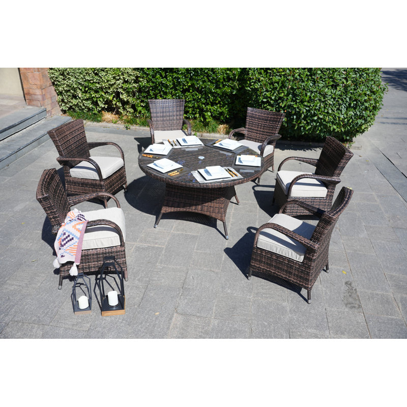 Therasa 6 - Person Patio Dining Set with Round Table , Cushions Included, Brown
