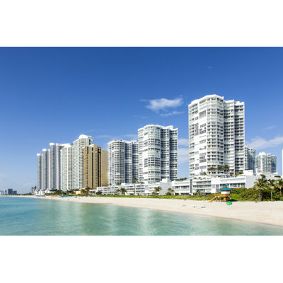 Skyscraper In Sunny Islands by Meinzahn - Wrapped Canvas Print