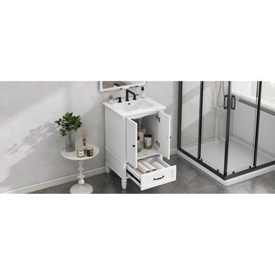 Meuble-lavabo de 51 cm (20 po) avec lavabo central en céramique, armoire à deux portes, tiroir, fermeture magnétique, pieds réglables, blanc avec patins de protection intégrés, style moderne