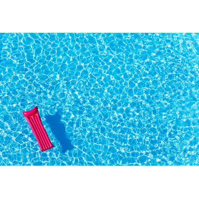 Inflatable Mattress Floating by SerrNovik - Wrapped Canvas Print