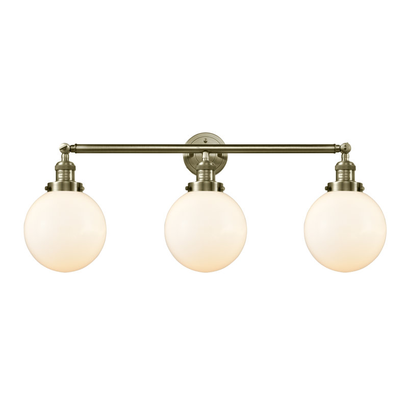 Éclairage pour meuble-lavabo en laiton antique à 3 lumières Lorri, Laiton antique, Blanc mat, Incandescente