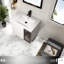 Meuble-lavabo mural compact avec lavabo en céramique, blanc brillant et verre gris