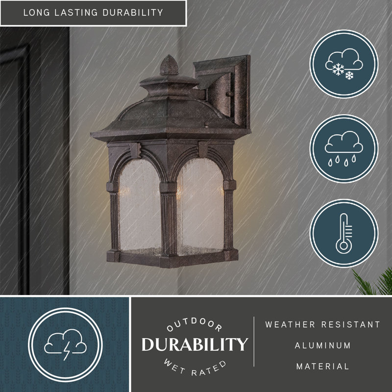 Rahul 13 in. H 1-Light Lava Stone Traditional Outdoor Wall Sconce made of Rust-Resistant Aluminum, Clear Seeded Glass Shade, LED Compatible, Use for Exterior Porch Patio Front Door or Garage