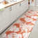 Delmoe High-Low Two-Tone Monstera Leaf Orange/Ivory Indoor/Outdoor Rug