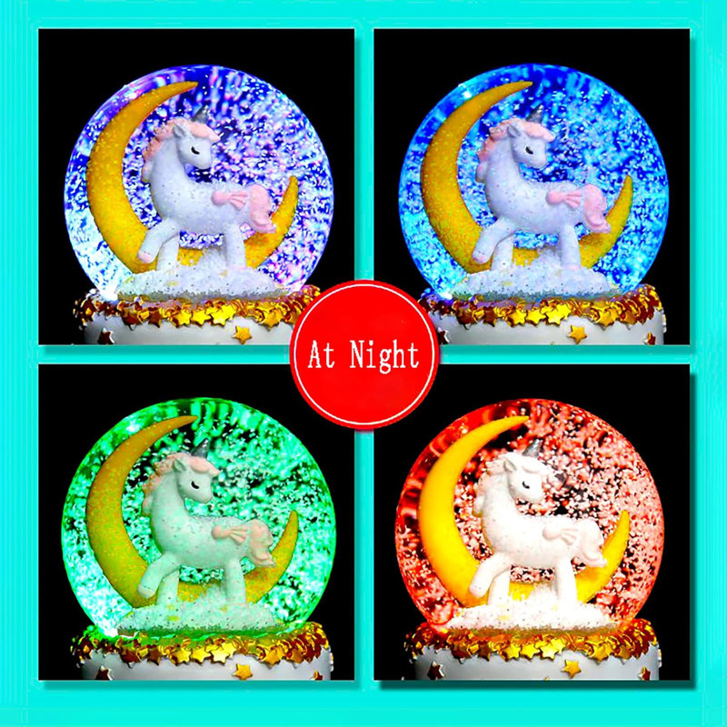Boule à neige licorne arc-en-ciel
