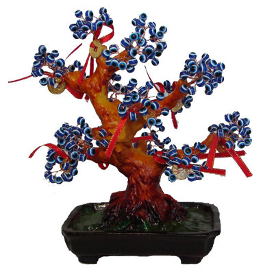 Sculpture arbre mauvais œil avec pièces